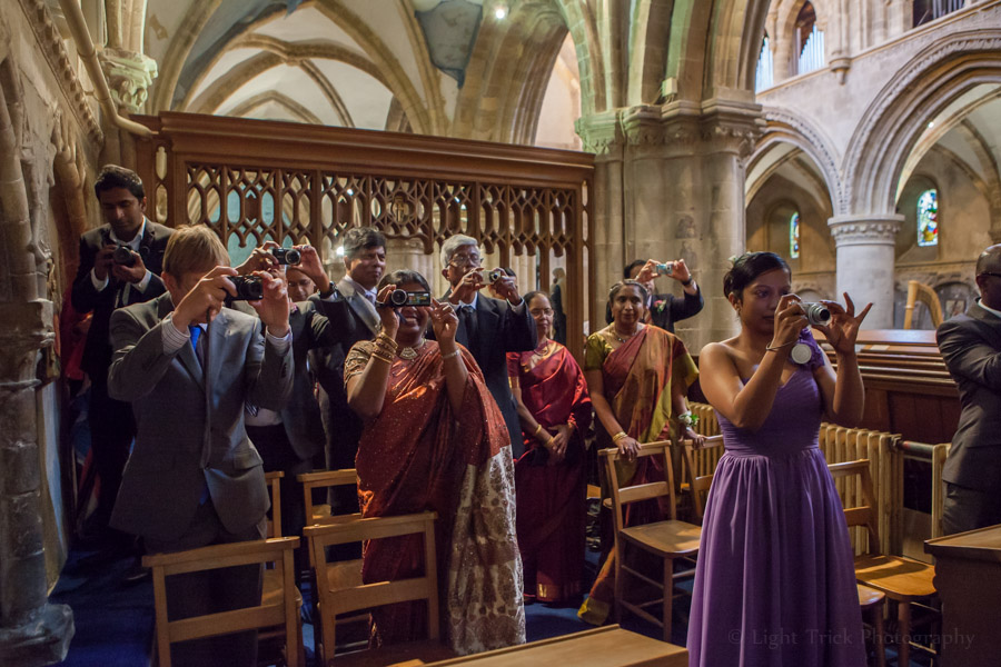 guests taking photos of signing of the register